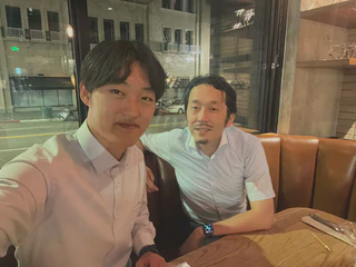 **Figure 1.**With my professor at a downtown bar around midnight.